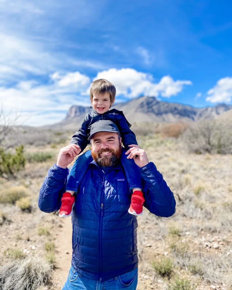 Robbie Hickey hiking in West Texas with his son.